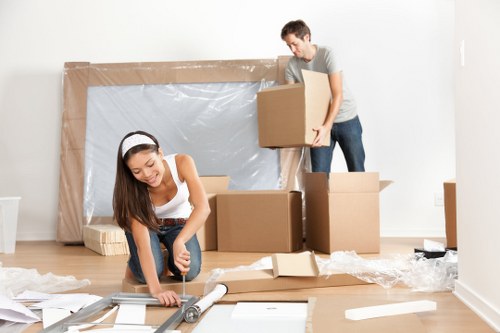 Removal van and moving boxes in a Fulham residential street