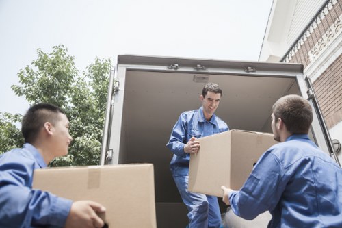 Careful wrapping of fragile belongings during a move in Fulham