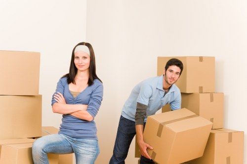 Office furniture being moved through a commercial building