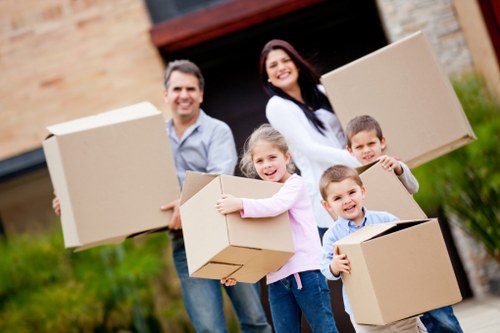 Careful moving of household furniture inside a Fulham home