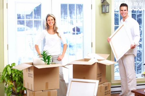 Packed office boxes and furniture ready for relocation