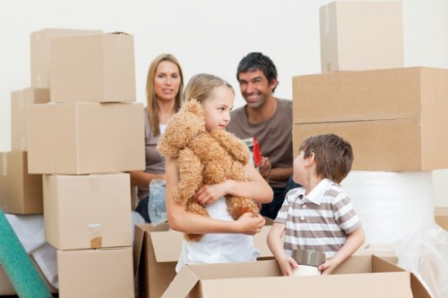 Packed office furniture and equipment ready for commercial removals