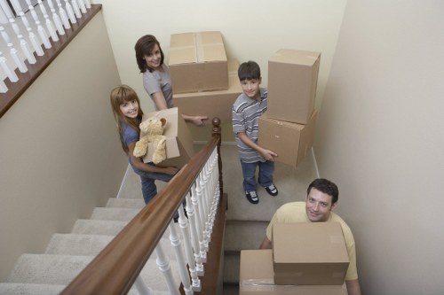 Packed moving boxes and furniture for a Fulham collection